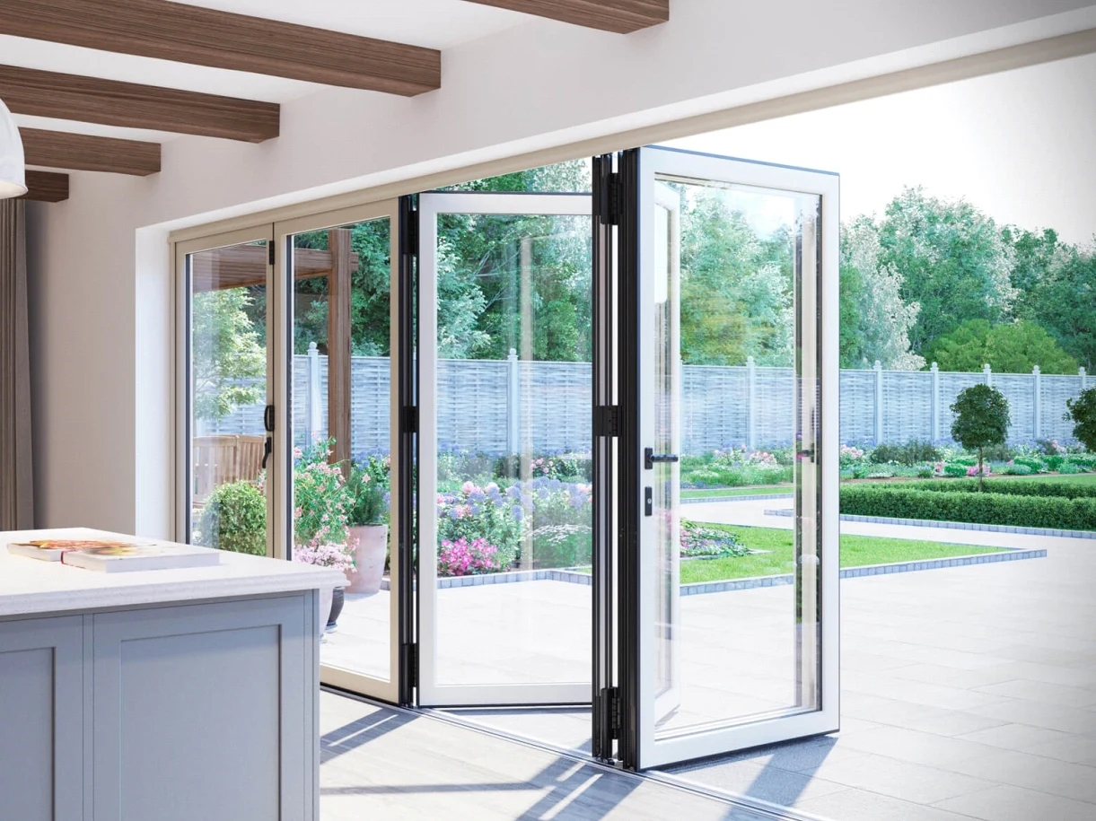 Folding glass doors connecting a kitchen to a garden